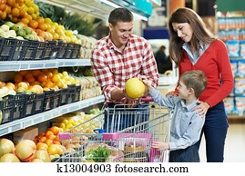 Family with child shopping fruits Family with child shopping fruits