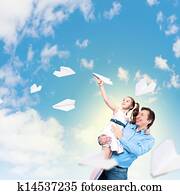 Father holding on hands daughter