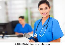female nurse holding tablet computer female nurse holding tablet computer