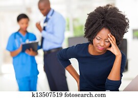 female sick patient in doctor's office