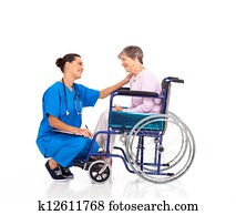 friendly nurse talking to senior patient