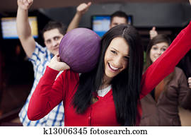 Friends bowling together Friends bowling together