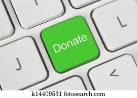 Green donate button on the keyboard close-up Green donate button on the keyboard close-up