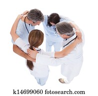 Group Of Doctors Making Huddle
