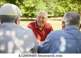 Group of senior men having fun and laughing in park