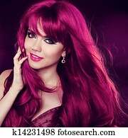Hairstyle. Red Hair. Fashion Girl Portrait with long Curly Hair. Beauty portrait of woman.