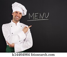 Handsome chef showing menu Handsome chef showing menu