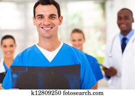 handsome medical doctor and team