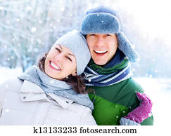 Happy Couple Having Fun Outdoors. Snow. Winter Vacation