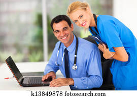 happy medical nurse and doctor in office