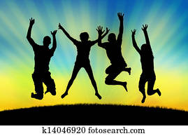 happy people jumping in joy on a sunset background