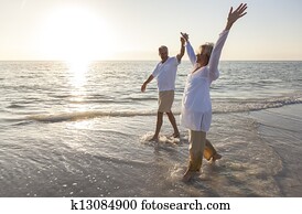 Happy Senior Couple Holding Hands Sunset Sunrise Beach Happy Senior Couple Holding Hands Sunset Sunrise Beach