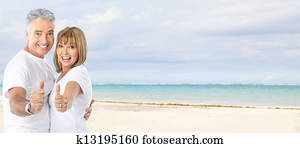 Happy senior couple on the beach.