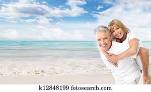 Happy senior couple on the beach.
