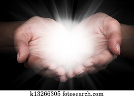Holding hands open with glowing lig Holding hands open with glowing lig