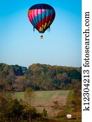 hot air balloon over farm land