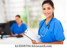 intern nurse holding a clipboard