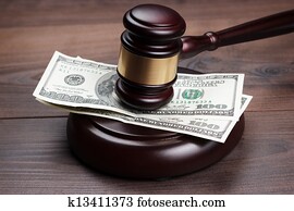 judge gavel and money on brown wooden table judge gavel and money on brown wooden table
