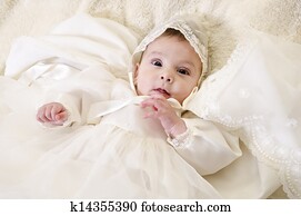 Little baby with ceremonial baptism clothes Little baby with ceremonial baptism clothes