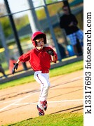 Little league baseball player running
