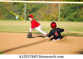 Little league player getting an out