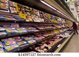 Meat on shelves in supermarket 