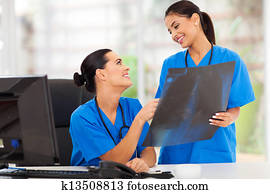 medical doctors discussing over x-ray 