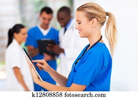 medical nurse using tablet computer