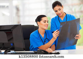 medical workers studying x-ray