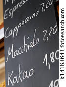 Menu On Blackboard In Coffee Shop