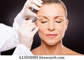 middle aged woman preparing for plastic surgery middle aged woman preparing for plastic surgery