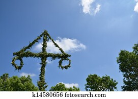 Midsummer pole at sky