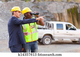 mine manager showing foreman mining site