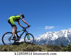Mountain biker riding through the mountains Mountain biker riding through the mountains