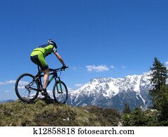 Mountain biker riding through the mountains Mountain biker riding through the mountains