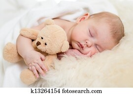 newborn baby sleeping on fur bed newborn baby sleeping on fur bed