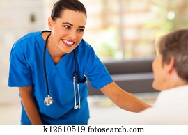 nurse talking to senior patient