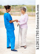 nurse talking to senior woman