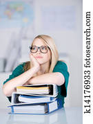 Overworked Businesswoman With Stack Of Binders