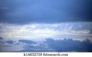 Peaceful scene with sun shining down through the clouds