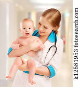 Pediatrician woman doctor holding baby Pediatrician woman doctor holding baby