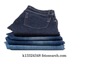 Pile of denim jeans