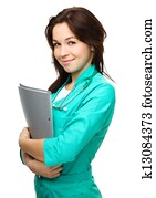 Portrait of a woman wearing doctor uniform