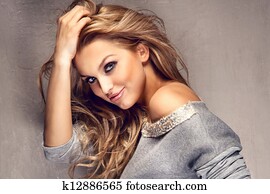 Portrait of beautiful blonde girl with long hair