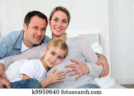 Portrait of family expecting new baby to come