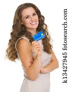 Portrait of happy young woman holding credit card