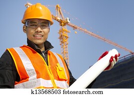Portraite site manager with safety vest under construction