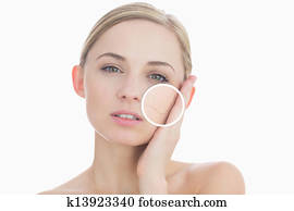 Pure woman touching her skin with close up of her wrinkles