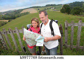 Retired people reading map on trekking day