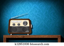 Retro radio on wood table with blue wallpaper background Retro radio on wood table with blue wallpaper background